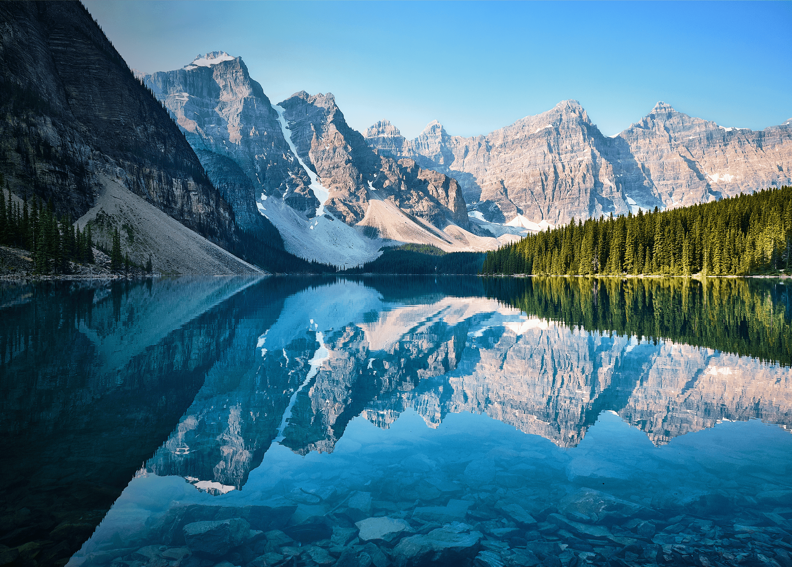 Hero image showing mountain-scape with snowy mountains and clean, clear water